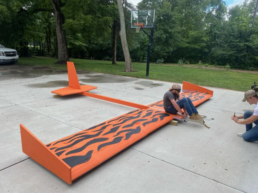 David sitting on the wing to test the pilot position.