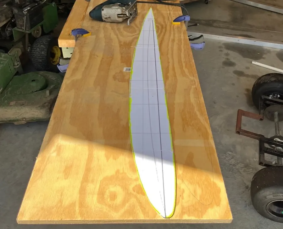 Plywood sheet with the airfoil stencil being cut out.